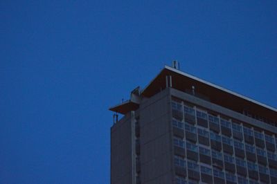 Low angle view of building against blue sky