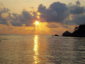 Scenic view of calm sea at sunset