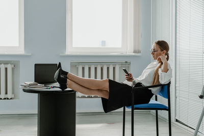 Young woman using mobile phone