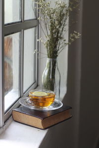 Close-up of tea on window