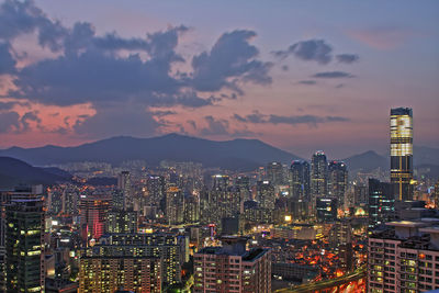 Illuminated cityscape against sky