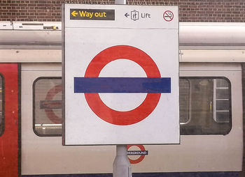 Close-up of stop sign on railroad station