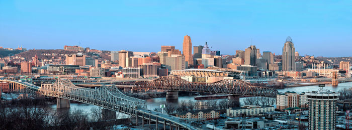 View of cityscape against blue sky