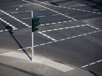 High angle view of road sign on street