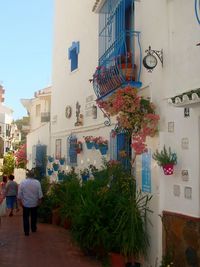 People on wall in city