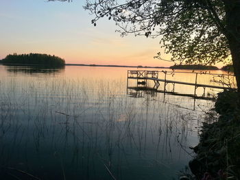 Scenic view of lake at sunset