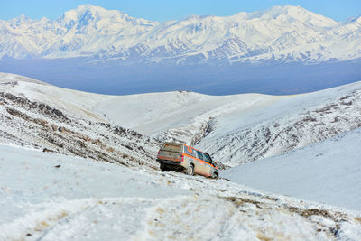 High angle view of car on snow mountains