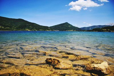 Scenic view of sea against blue sky