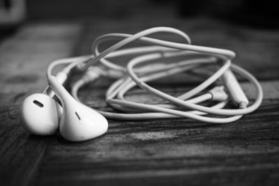 Close-up of in-ear headphones on table