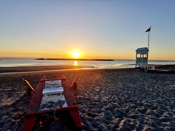 Scenic view of sea against clear sky during sunset