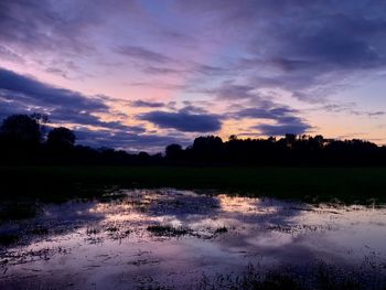 Scenic view of lake against sky during sunset