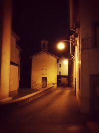 Illuminated walkway at night