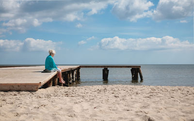 Full length of man on beach against sky