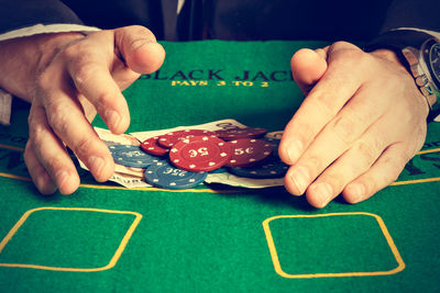 Close-up of man holding table