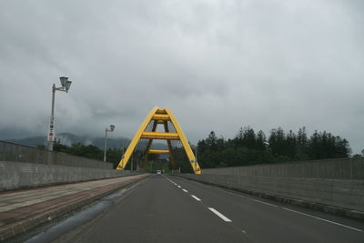 View of bridge against cloudy sky