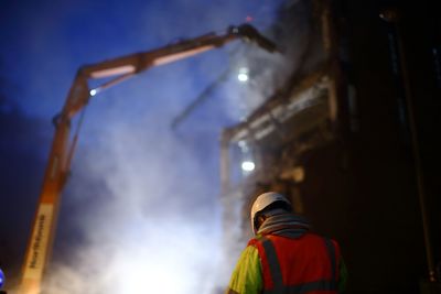 Rear view of construction worker wearing helmet