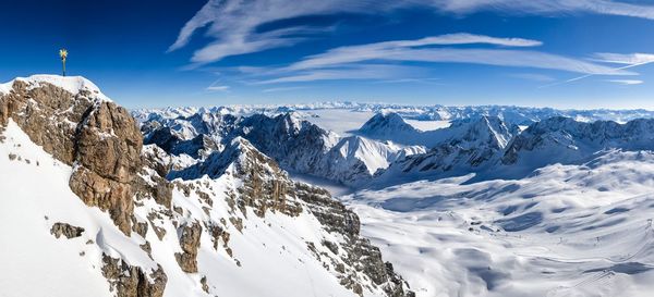 Scenic view of snowcapped mountains against sky