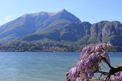 Scenic view of sea and mountains against sky