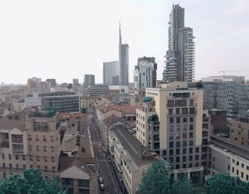 Skyscrapers in city against clear sky