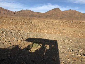 Shadow of people on desert