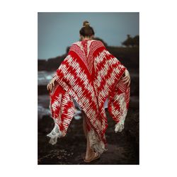 Rear view of woman with umbrella standing in snow