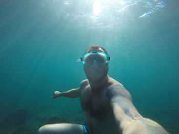 Man swimming in sea