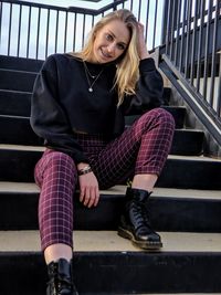 Portrait of teenage girl sitting on staircase