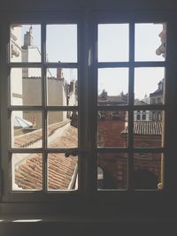 Buildings seen through glass window