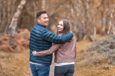 Happy couple standing outdoors