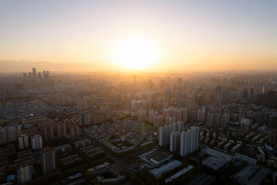 High angle view of townscape against sky during sunset