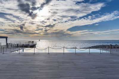 Winter sunset over the bay of portopiccolo sistiana. duino. italy