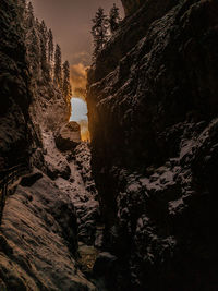 Low angle view of rock formations against sky during sunset