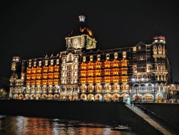 Illuminated buildings in city at night