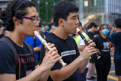 People enjoying music in city