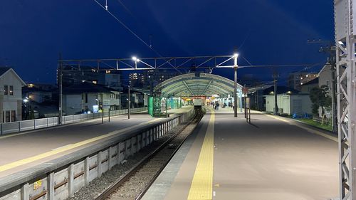 View of railroad station platform at night