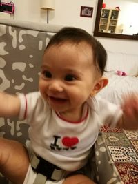 Portrait of smiling boy at home