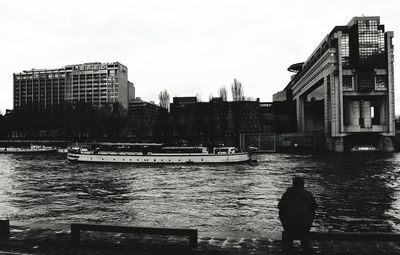 River in city against sky