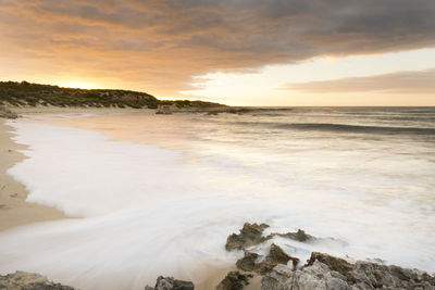 Scenic view of sea against sky during sunset