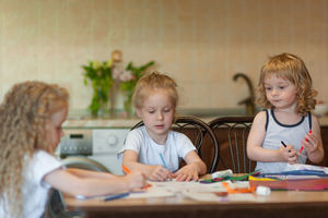 Girls doing craft while sitting at home