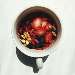 Close-up overhead view of food on white surface