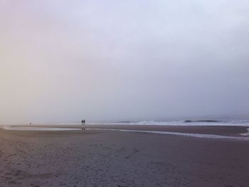 Scenic view of beach against clear sky