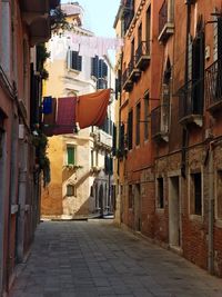 Narrow street amidst buildings in town