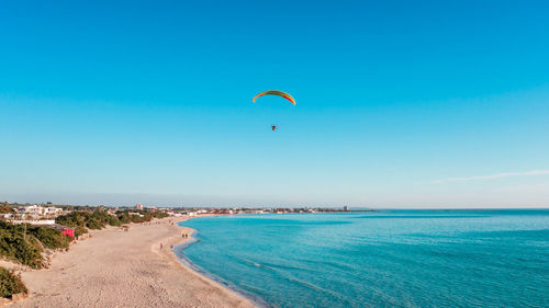 Scenic view of sea against blue sky