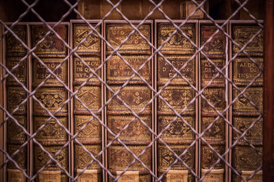 Full frame shot of metal fence against building