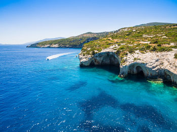 Scenic view of sea against clear blue sky