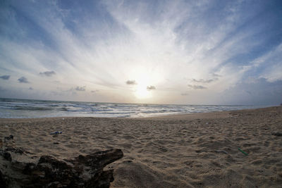 Scenic view of beach against sky during sunset