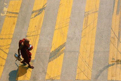 High angle view of monk walking on road