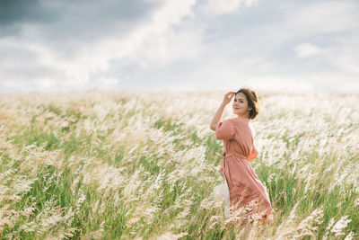 Woman standing on field