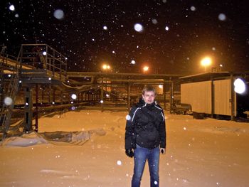 Full length portrait of man standing in snow