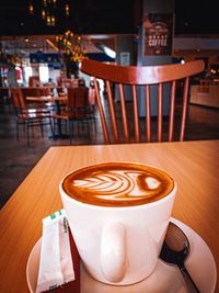 Coffee cup on table in cafe